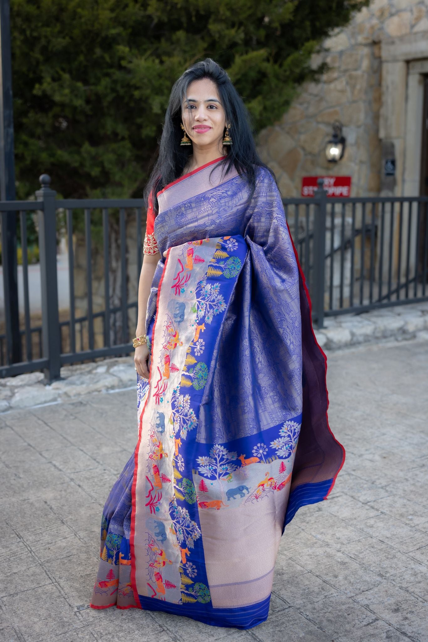 Royal Blue Banaras Saree With Jungle Theme Border and Red Blouse