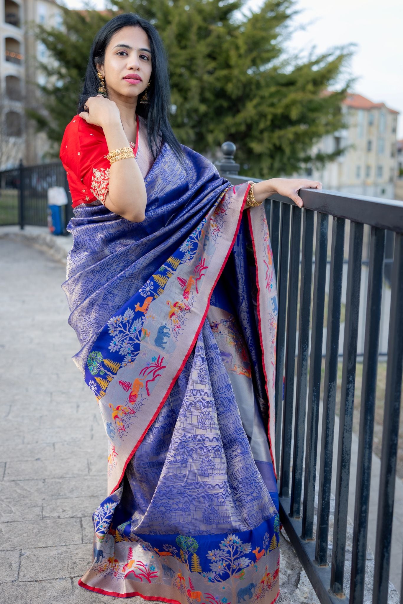 Royal Blue Banaras Saree With Jungle Theme Border and Red Blouse