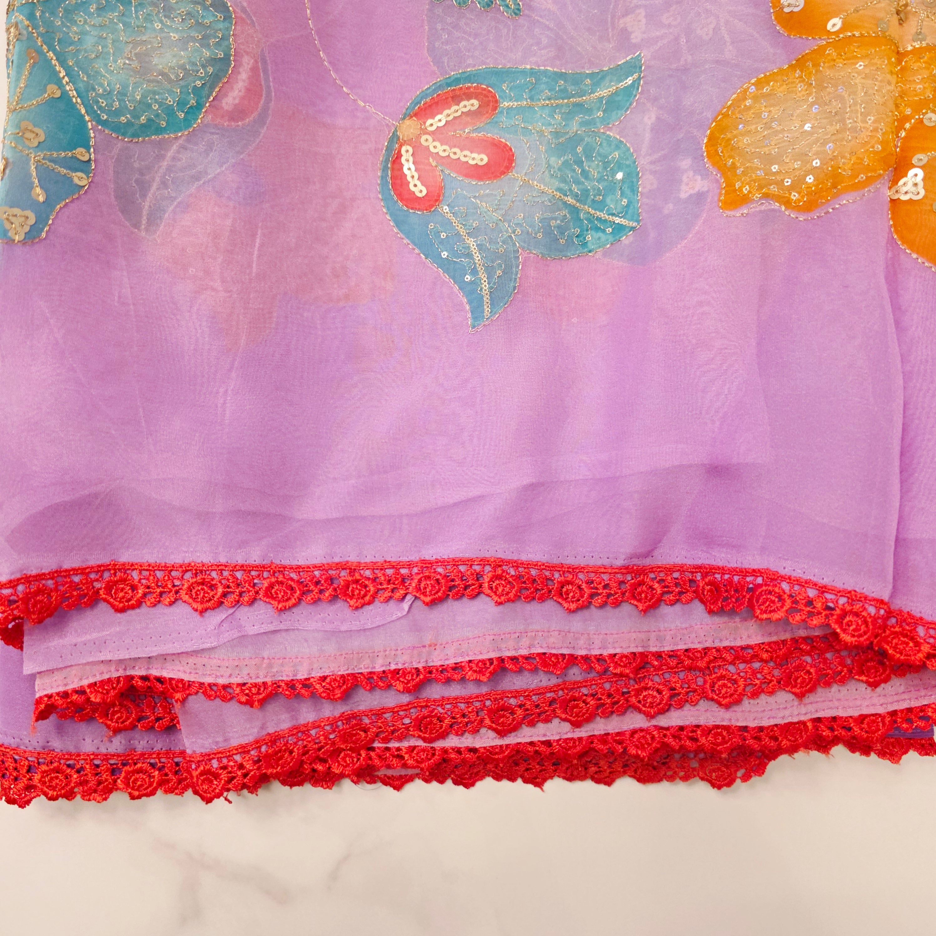 Purple Latest and Trendy Saree with Floral Hibiscus theme in paired with cute short sleeve blouse