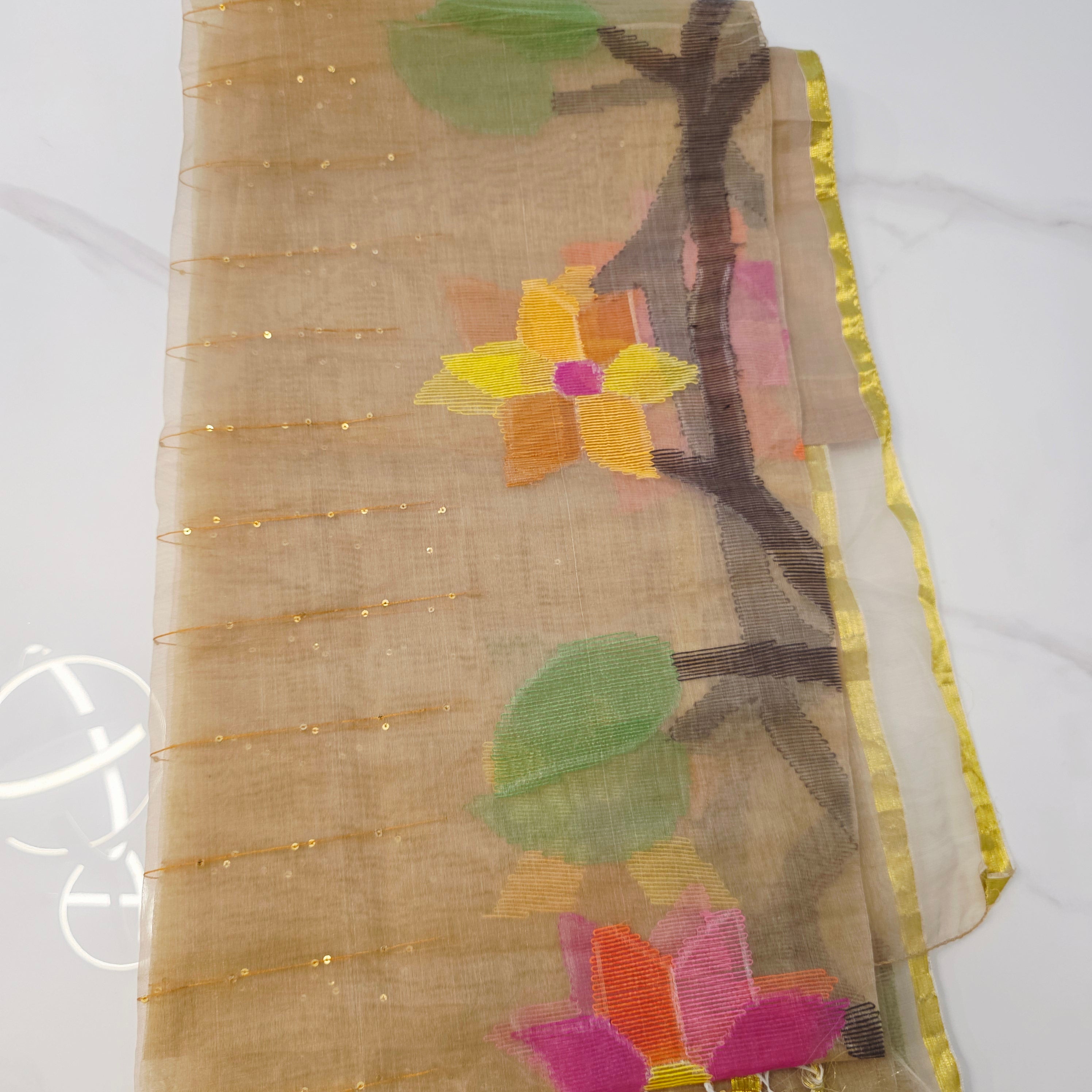 Muslin Jamdani in Gold paired with Rawsilk Maggamwork sleeveless Blouse