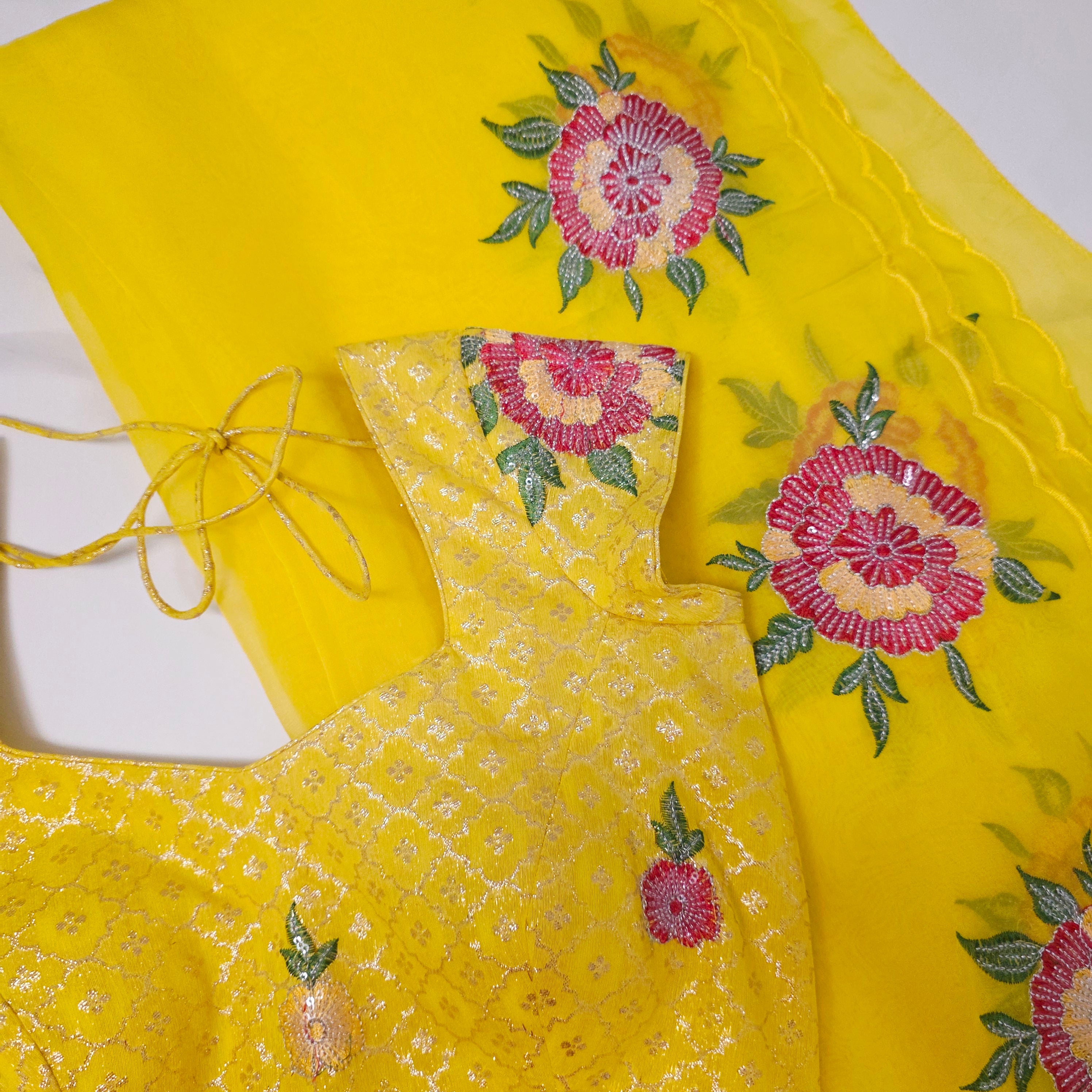 Yellow Saree With Floral Work Border paired with patterend blouse