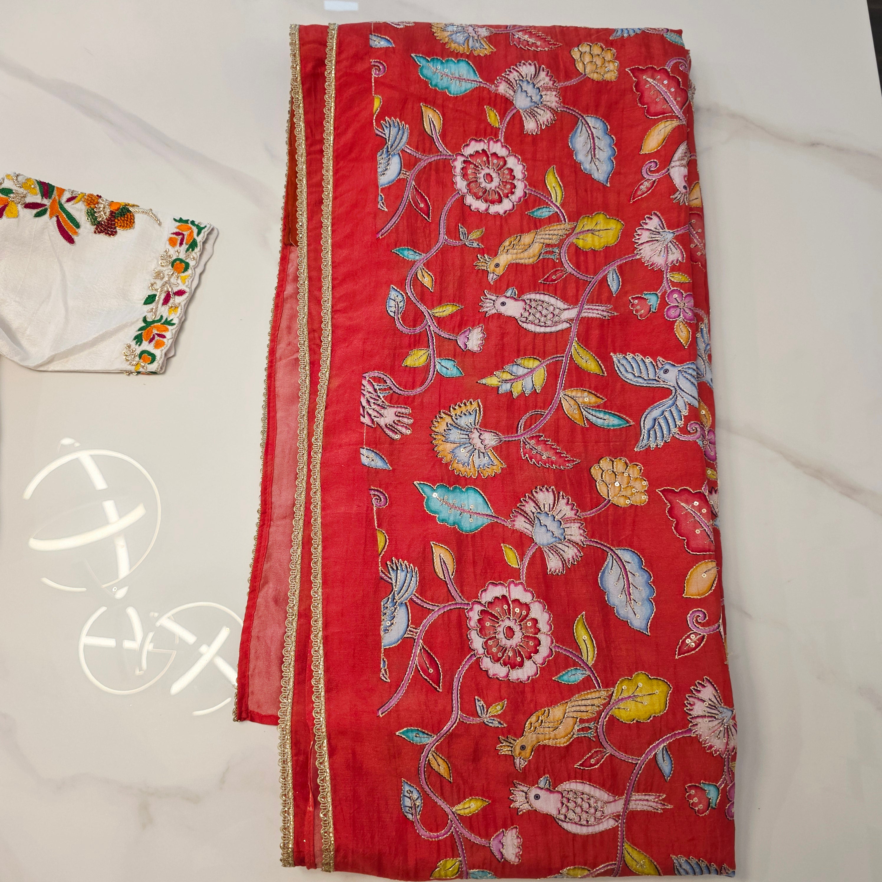 Orange Falling Rawsilk Saree with all over  kalamkari pattern in parrots theme with Beautiful Blouse