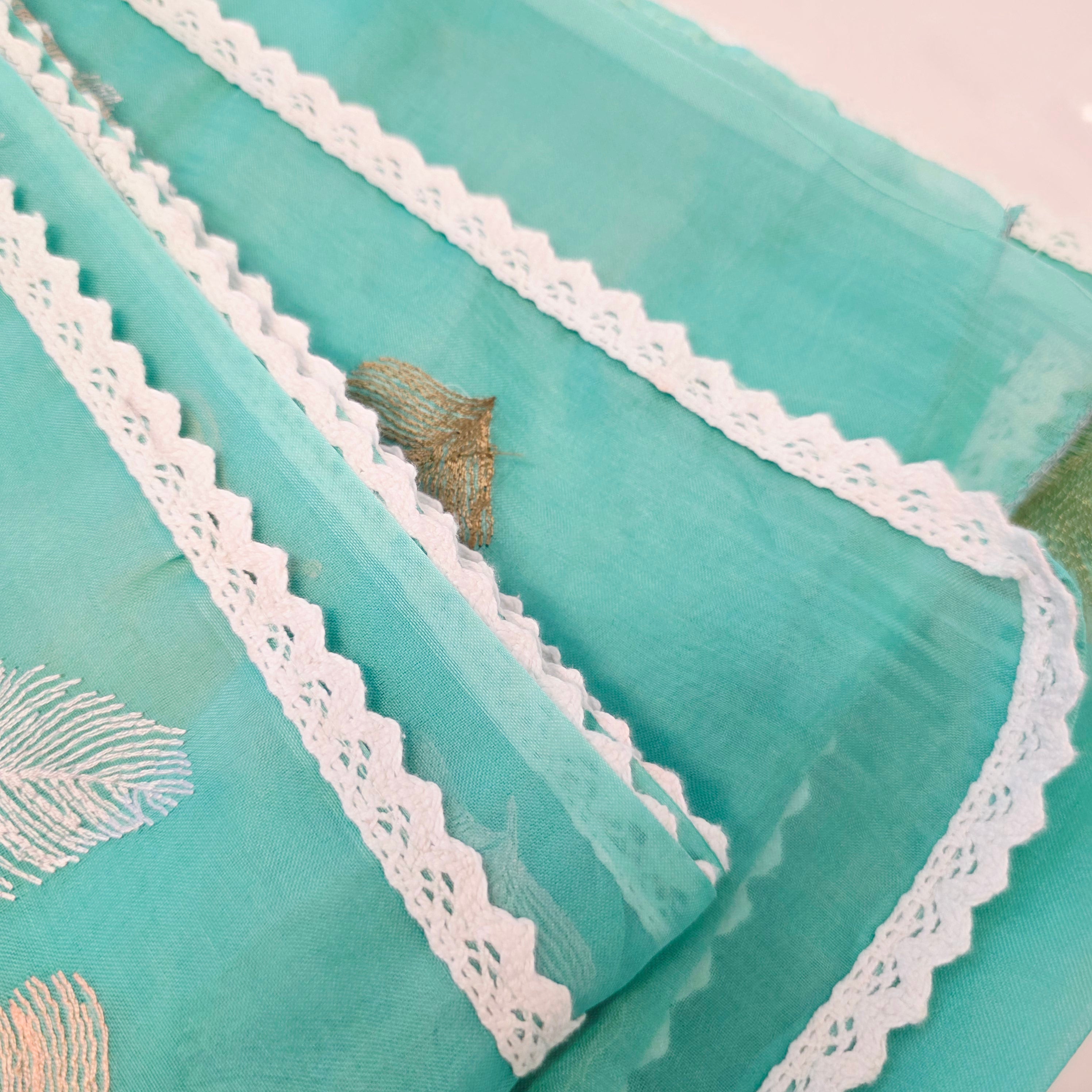 Teal blue organza saree with leaf embroidery
