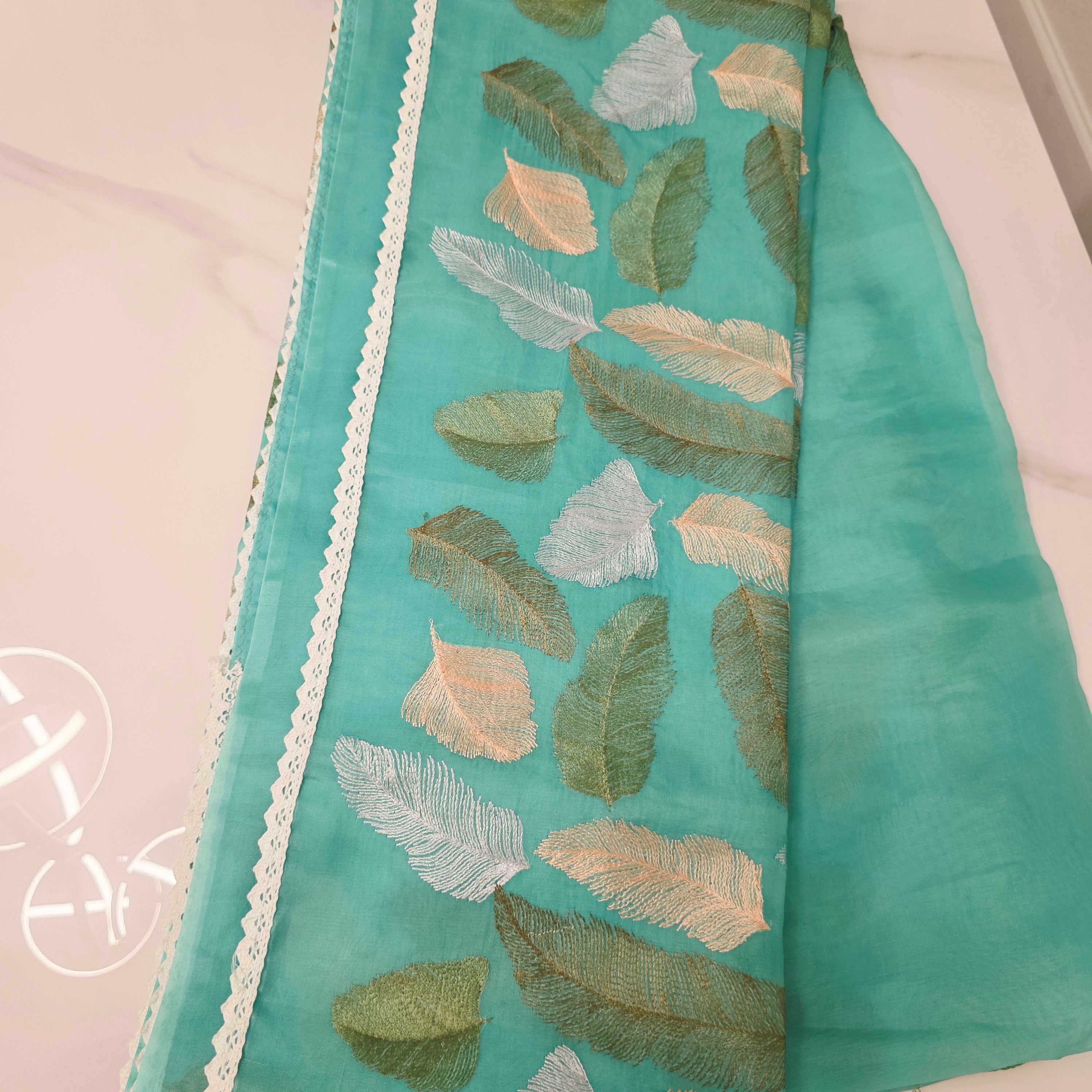 Tealblue Soft Organza Saree with leaf embroidery allover. Paired with soft sequin blouse.