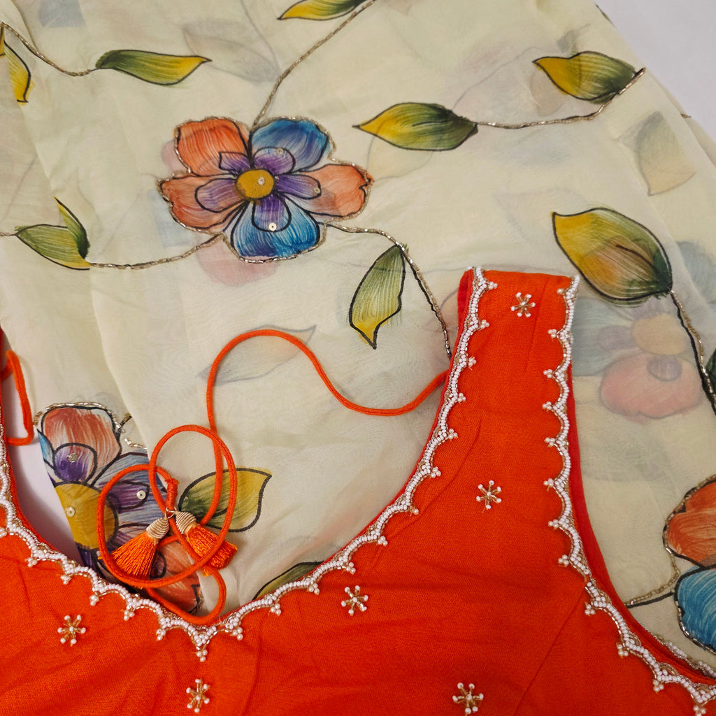 Hellgelbe, zähflüssige Organza-Sari mit orangefarbener Designerbluse