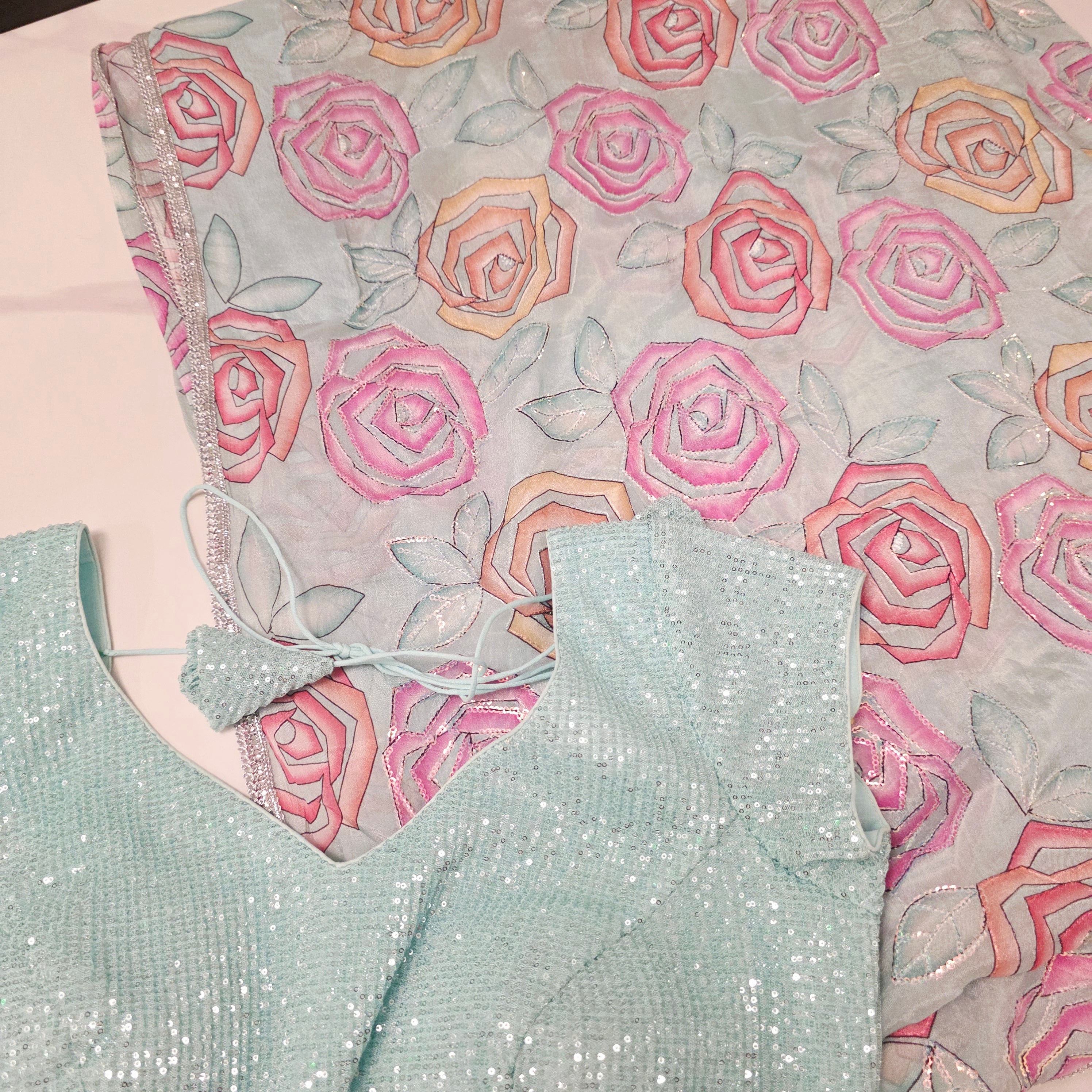 Skyblue Sequin Partywear Saree With allover Roses paired with soft sequin blouse