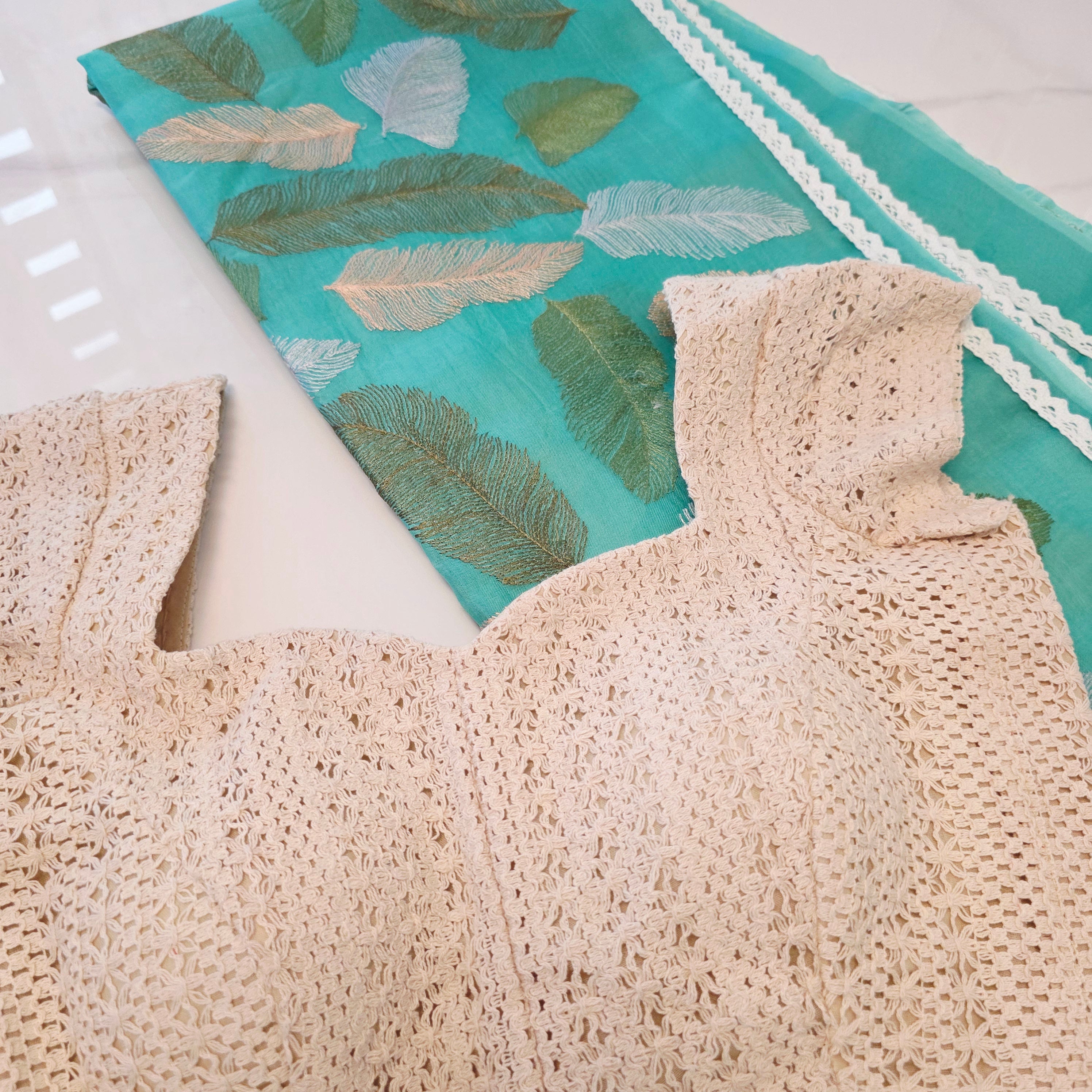 Teal blue organza saree with leaf embroidery