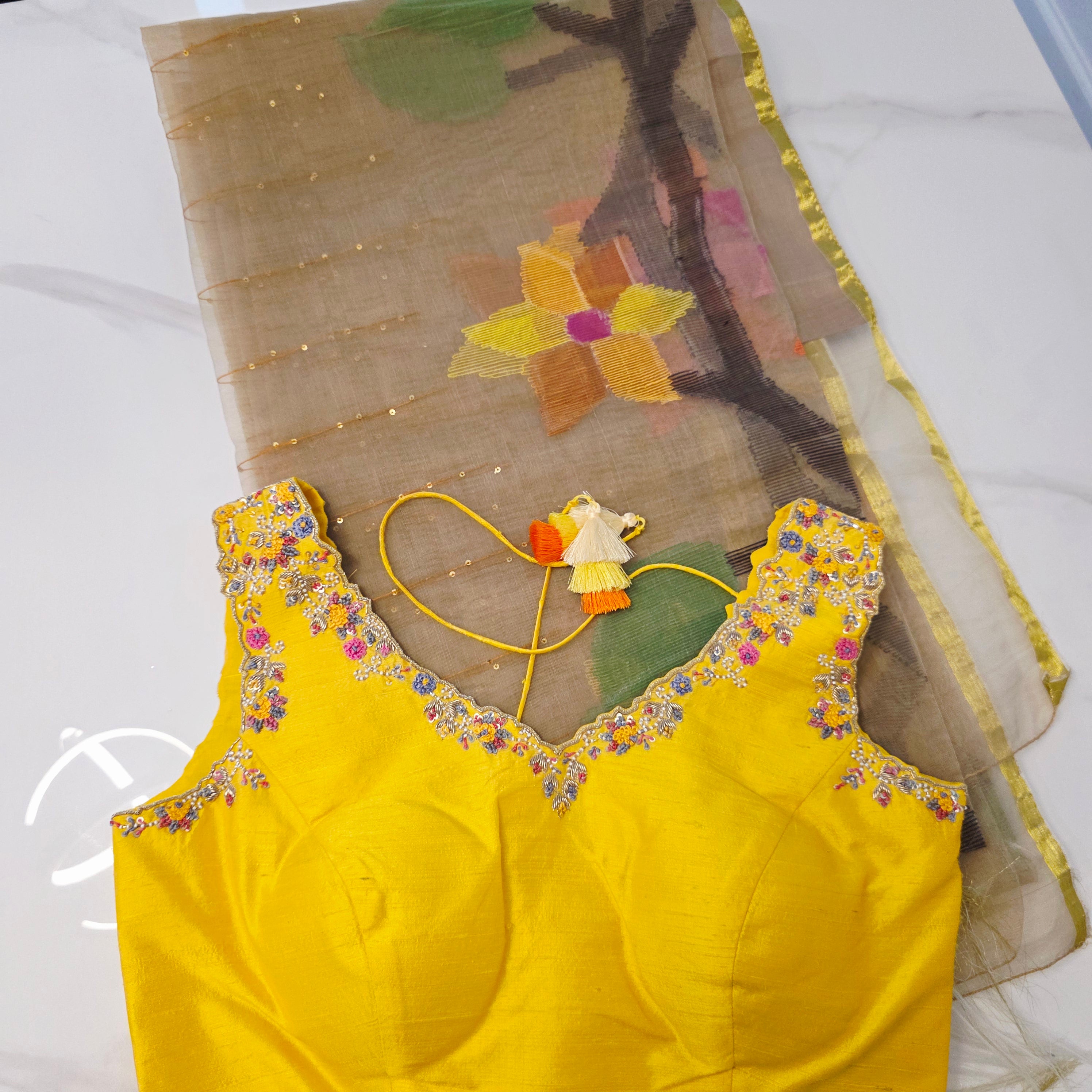 Muslin Jamdani in Gold paired with Rawsilk Maggamwork sleeveless Blouse