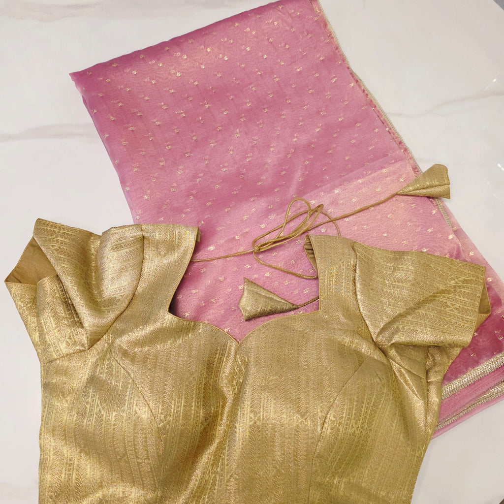 Pinker fallender Tissue-Saree mit goldener Bluse