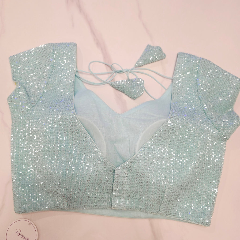 Skyblue Sequin Partywear Saree With allover Roses paired with soft sequin blouse