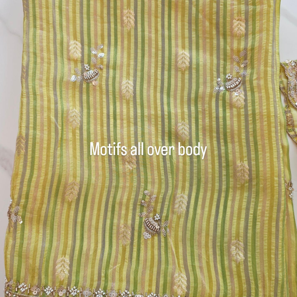 Womens yellow cocktail saree with sabhyasachi border