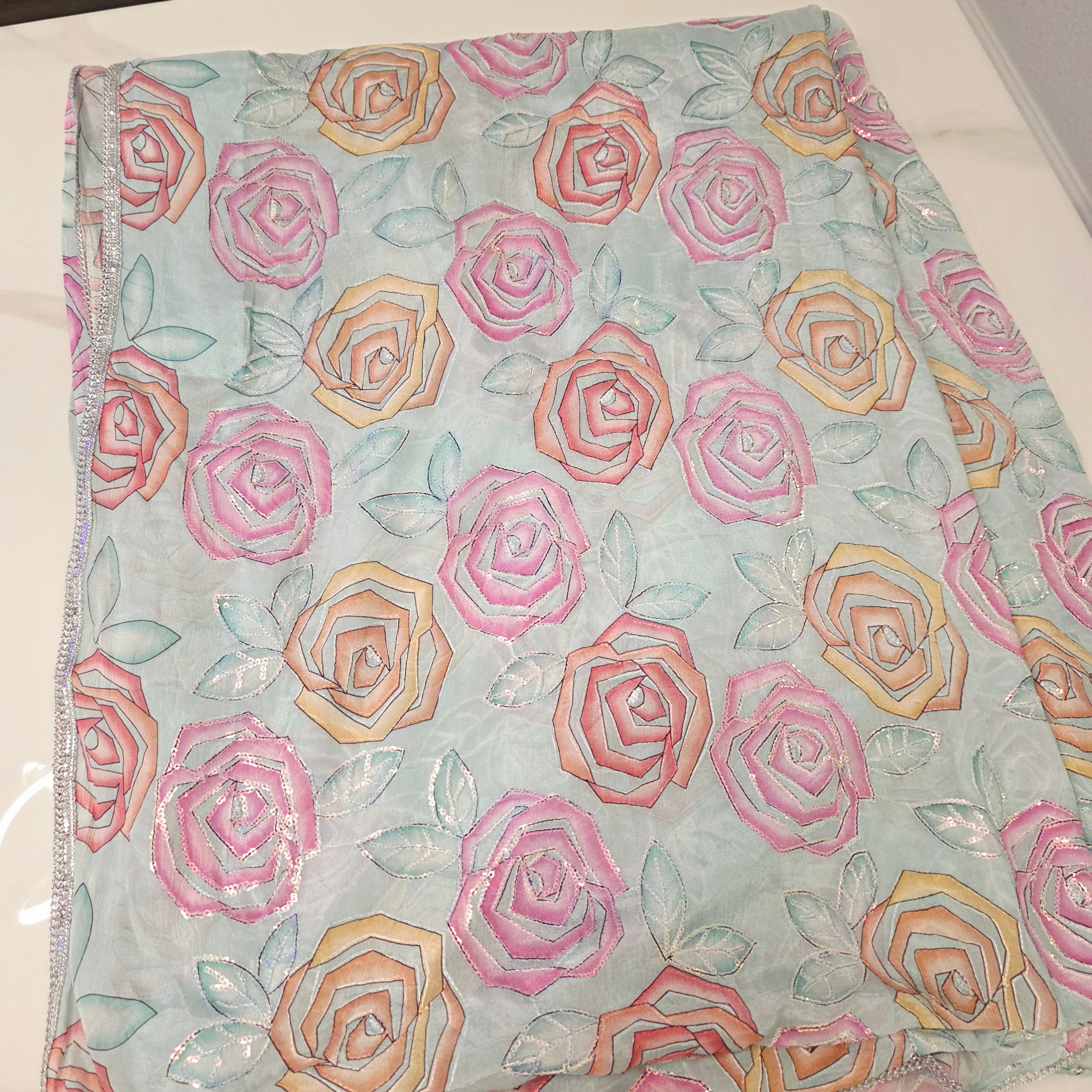 Skyblue Sequin Partywear Saree With allover Roses paired with soft sequin blouse