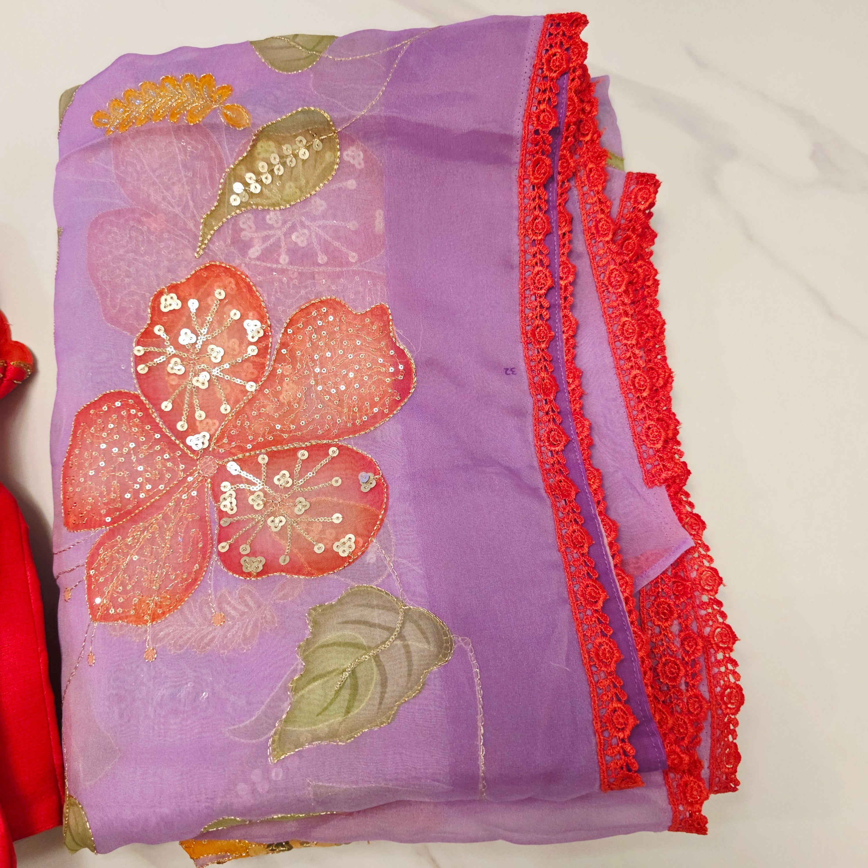 Purple Latest and Trendy Saree with Floral Hibiscus theme in paired with cute short sleeve blouse