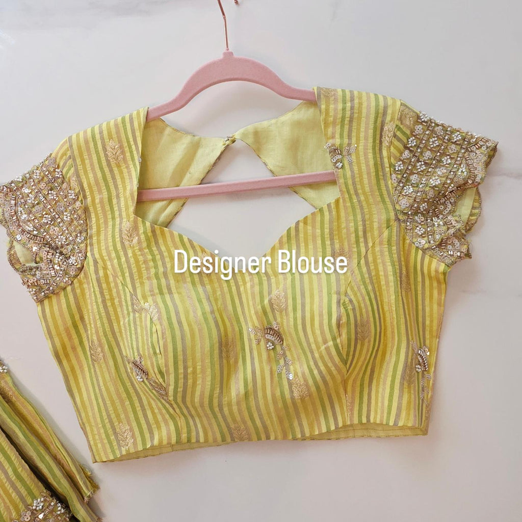 Womens yellow cocktail saree with sabhyasachi border