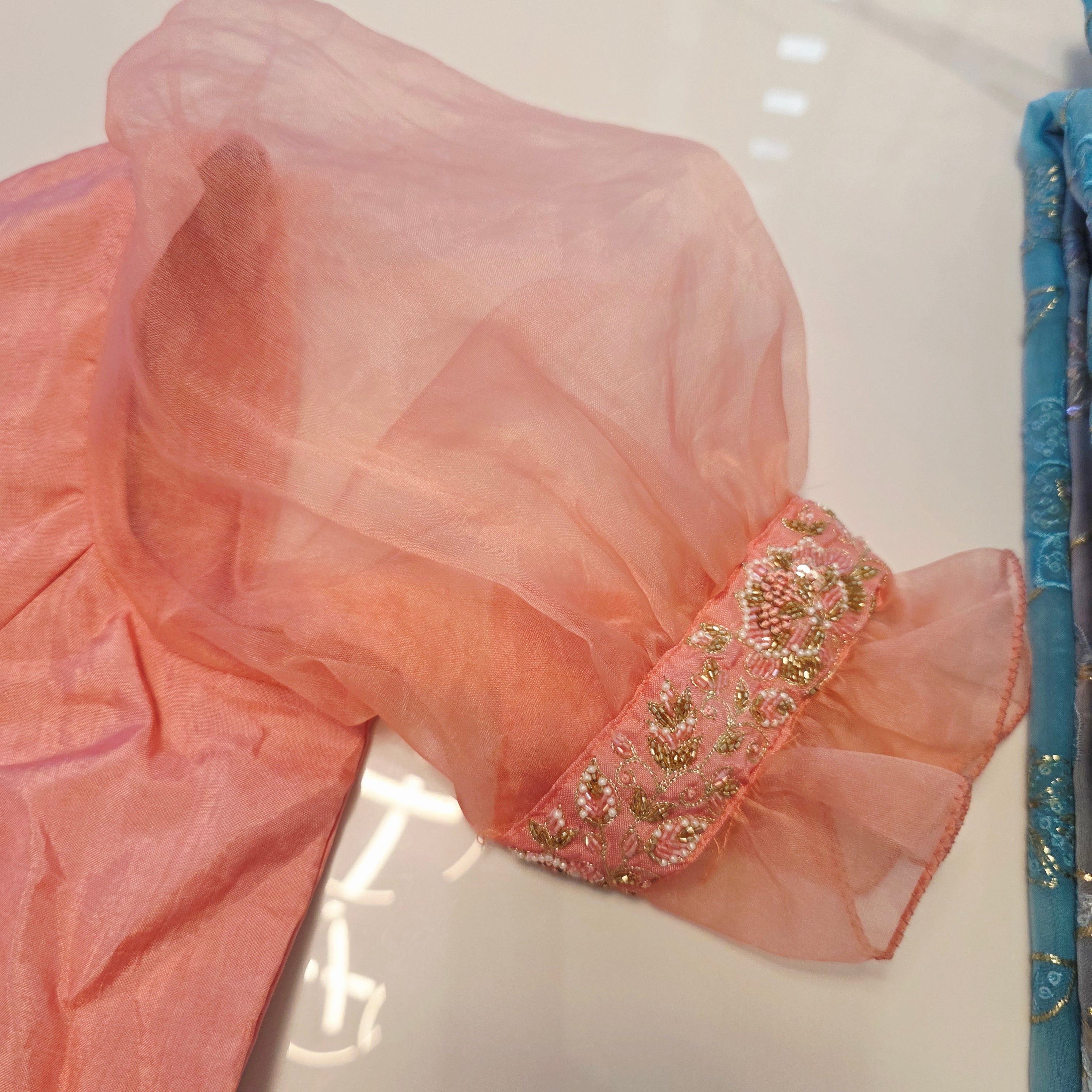 Pink and Blue Designer Saree with trending sleeves blouse.