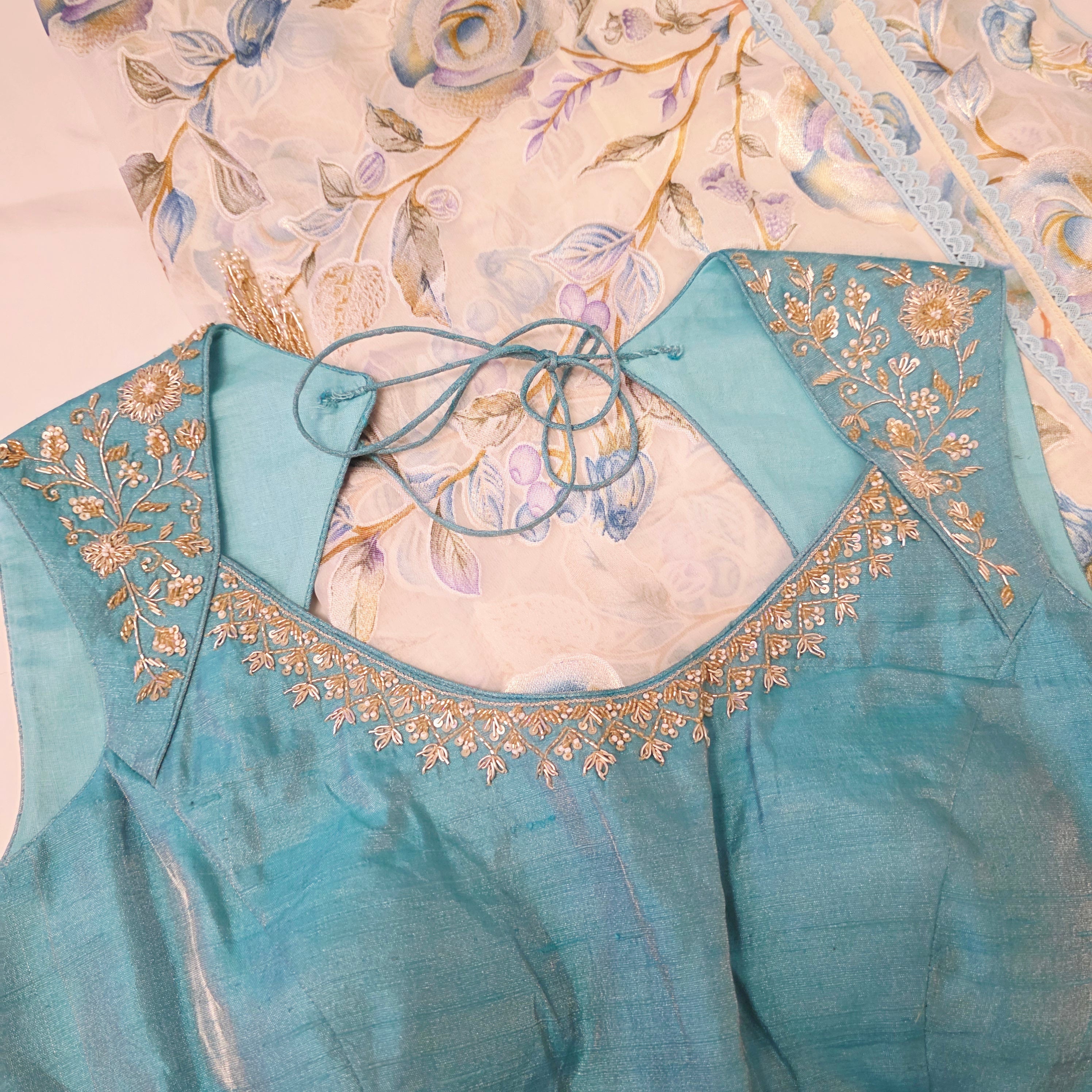 White and Blue Brasso Saree with Rawsilk Maggamwork Blouse