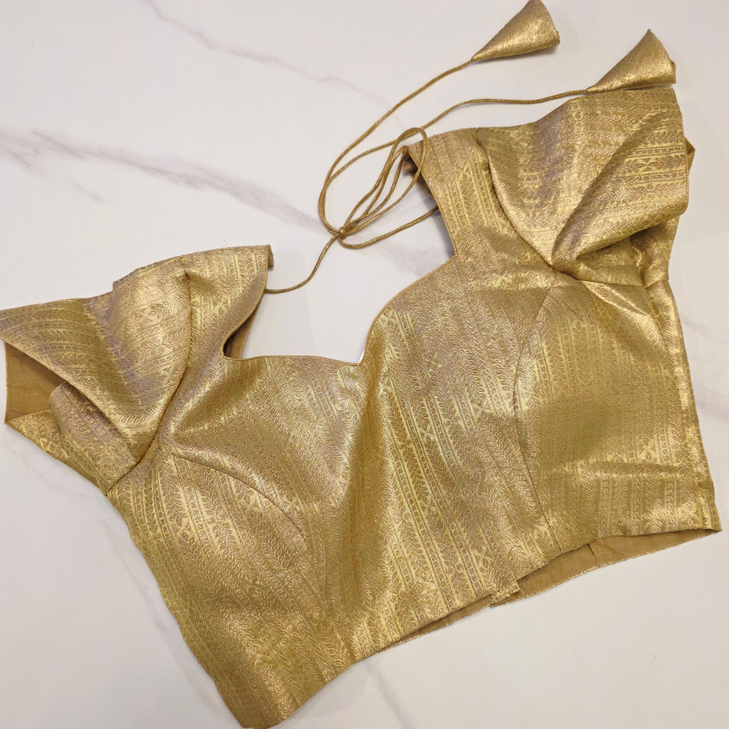 Pinker fallender Tissue-Saree mit goldener Bluse