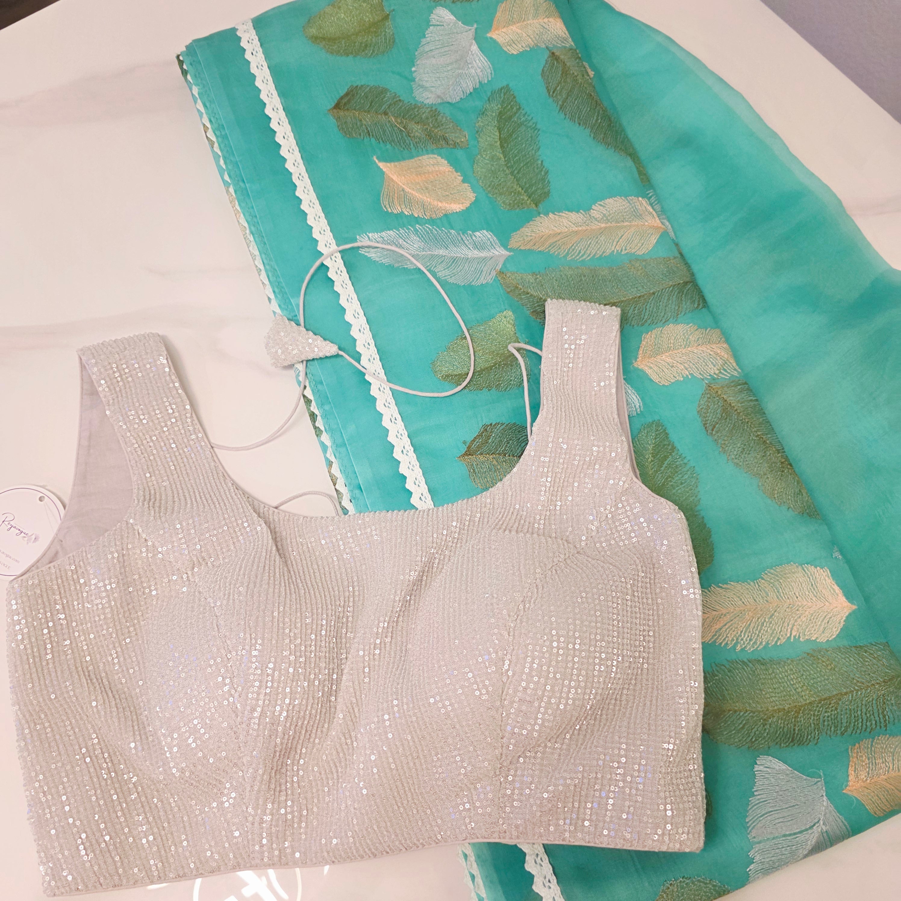 Tealblue Soft Organza Saree with leaf embroidery allover. Paired with soft sequin blouse.