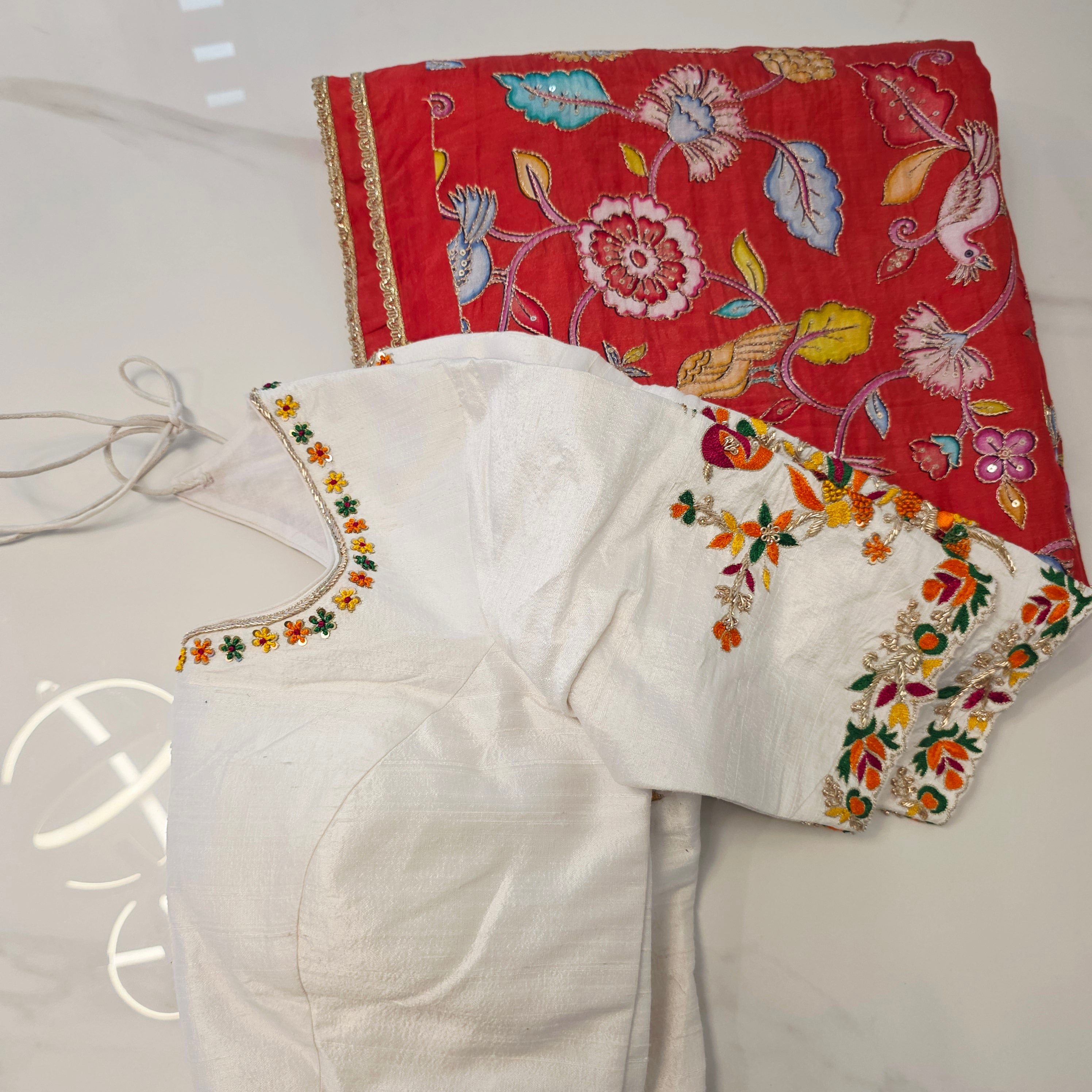 Orange Falling Rawsilk Saree with all over  kalamkari pattern in parrots theme with Beautiful Blouse