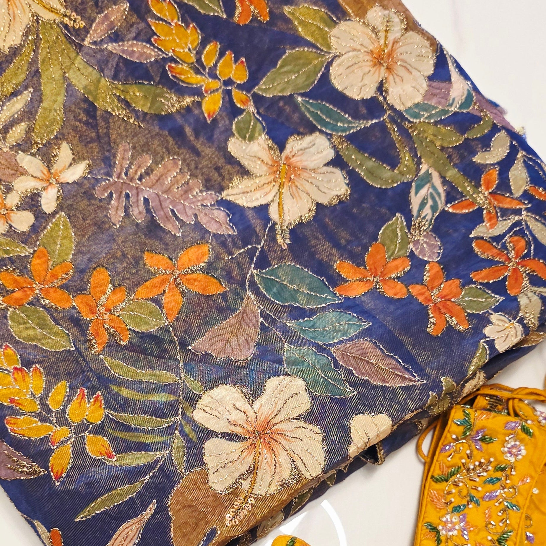 Floralpattern saree with yellow silk blouse