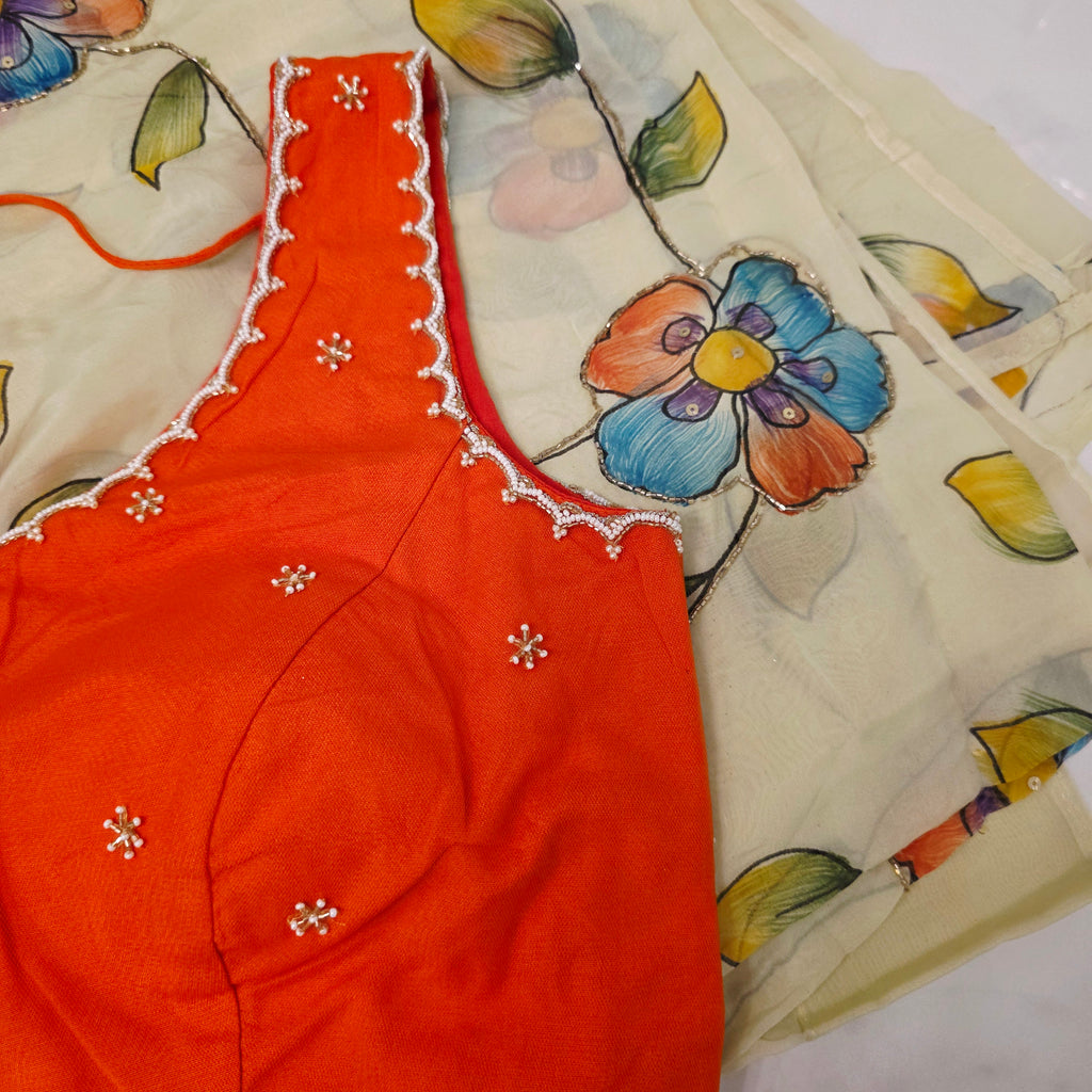 Hellgelbe, zähflüssige Organza-Sari mit orangefarbener Designerbluse